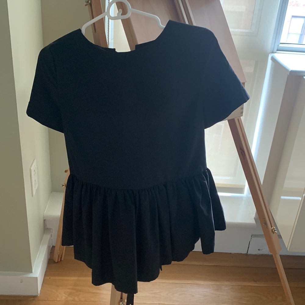 Black peplum top with bows
